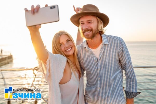 202106young attractive smiling happy man woman traveling bicycles taking selfie photo phone camera romantic couple by sea sunset boho hipster style outfit friends having fun together
